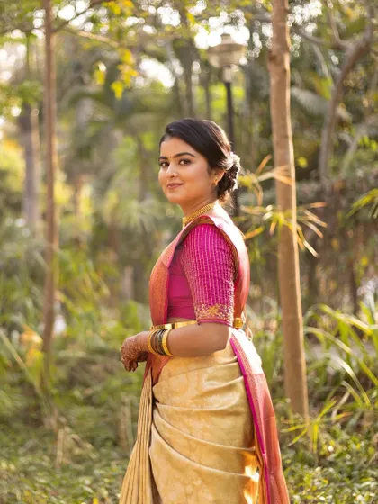 Shubha looking elegant for her pre-wedding ritual. The simple updo and minimal jewelry create a very graceful look.