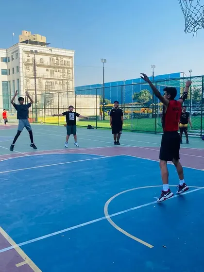 Players practice their shooting form, focusing on follow-through and arc.