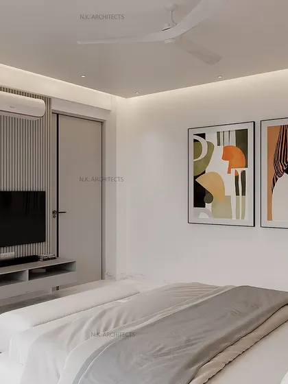 A minimalist bedroom can still feel warm and sophisticated. This design uses a grey and white color scheme, with clean lines, abstract art, and a fluted panel behind the TV to add texture and create a calm, modern vibe.