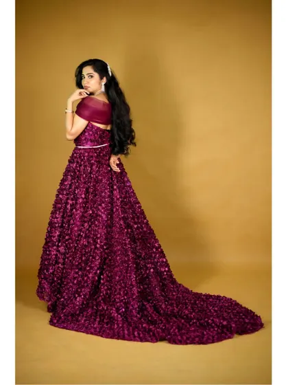 The back view of our wine floral high-low gown, showing off its incredible long tail. This gown is perfect for creating dramatic, high-fashion looks.