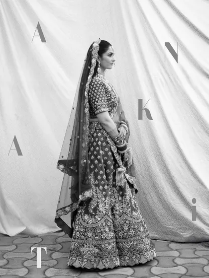 A stylish black and white full-length portrait with the bride's name artistically placed.