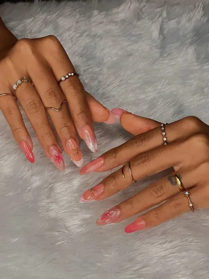 A full view of this dramatic and beautiful nail set, showcasing the length, shape, and intricate details that our students learn to master.