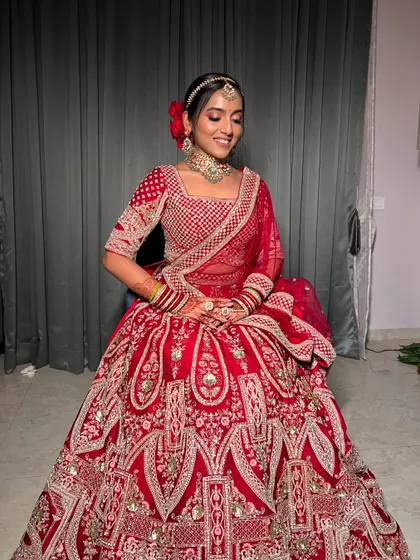 Another full-length shot capturing the grandeur of the bridal lehenga and the elegance of the overall look.