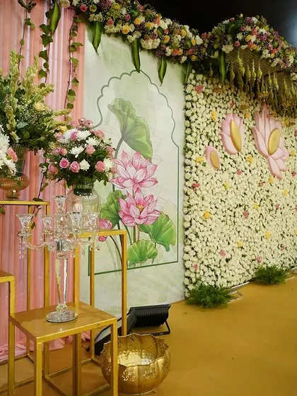 Here you can see the final lotus-themed decor next to the initial mock-up. Witnessing the transformation from a digital design to a magical, real-life floral masterpiece is always a rewarding part of the process.