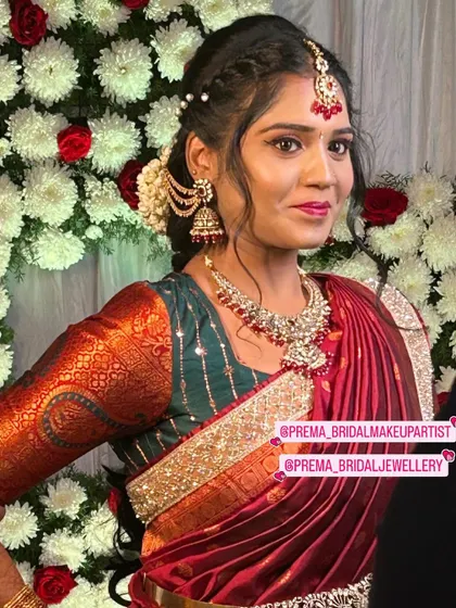 A close-up of the client, showing the details of the maang tikka and necklace.
