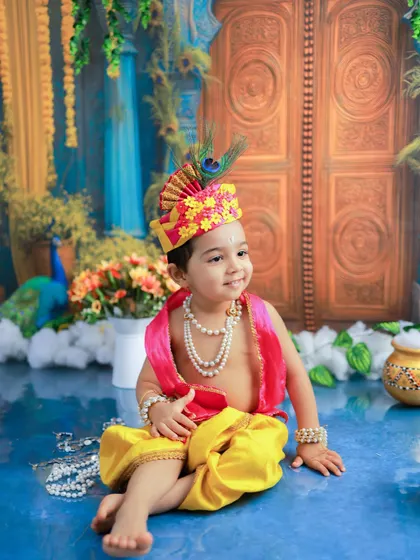 A sweet, seated pose of our little Kanha. The soft smile and gentle posture make this an incredibly endearing and timeless portrait.