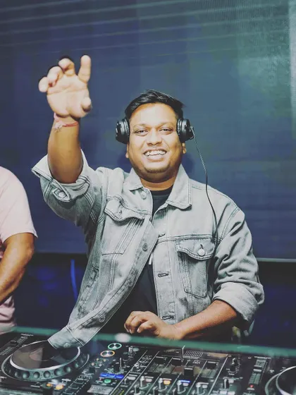 A happy moment, interacting with the crowd. A good DJ is always watching the dance floor, reading the room, and adjusting the set.