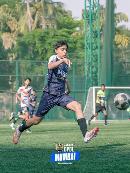 A player leaps to connect with the ball, showing great athleticism and timing.