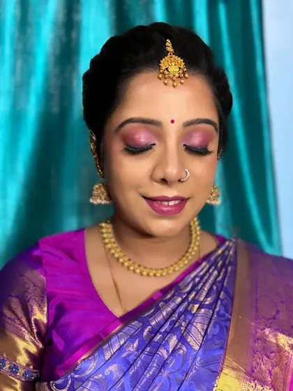 A gorgeous look for her baby shower. We chose a vibrant pink and purple theme for her makeup to match her stunning silk saree, creating a look that was both festive and elegant.