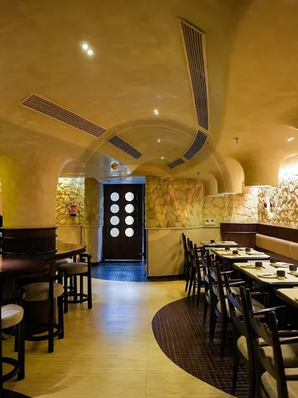 The long dining hall at 'Call me Ten', lined with our custom-designed tables and chairs. The layout and furniture are planned for both aesthetic impact and functional restaurant service.