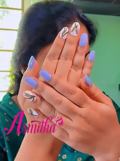 A view of the periwinkle and white marble nail art, showing how the design looks when the hands are posed together.