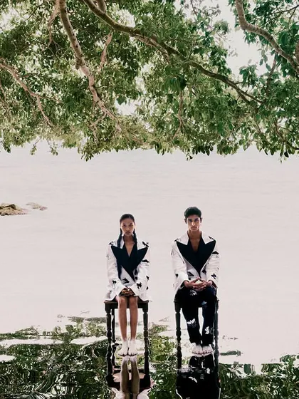 Another surrealist concept for 'All Beneath Heaven', with two models sitting on chairs in the water. The reflection creates a perfect, symmetrical dreamscape.