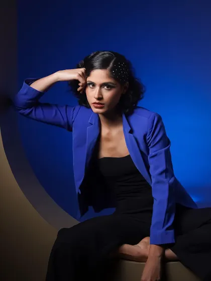 A direct and engaging portrait from the same series, where the model's gaze connects with the viewer.