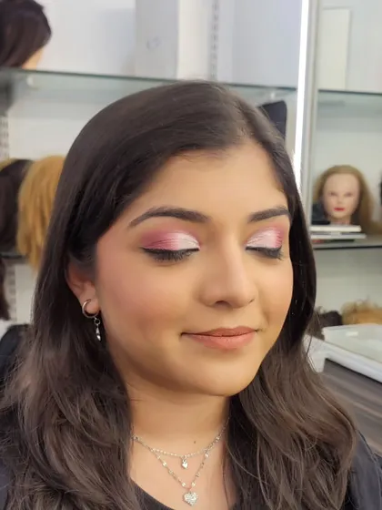 A close-up showing the blend of a pink and white semi cut crease. The shimmer on the lid catches the light beautifully, making the eyes sparkle.