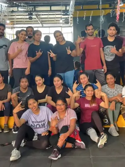 A duplicate image of our Zumba crew celebrating their hard work with fun poses.