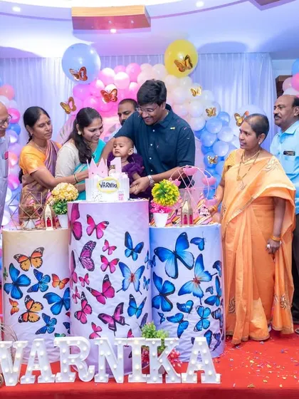The cake-cutting ceremony at a first birthday, with grandparents and parents gathered around the baby. We position ourselves to capture the joy and involvement of all your closest family members.