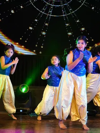Our junior Bollywood troupe performing at Zest 25. Dressed in sparkling blue and gold costumes, they brought the fun and flair of filmy dance to life.