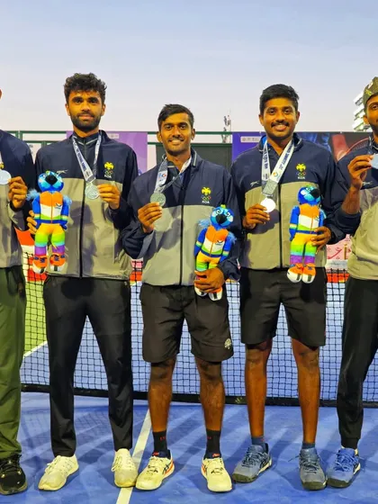 The men's team from Karnataka with their medals at the 38th National Games. We are proud to contribute to the state's tennis success.