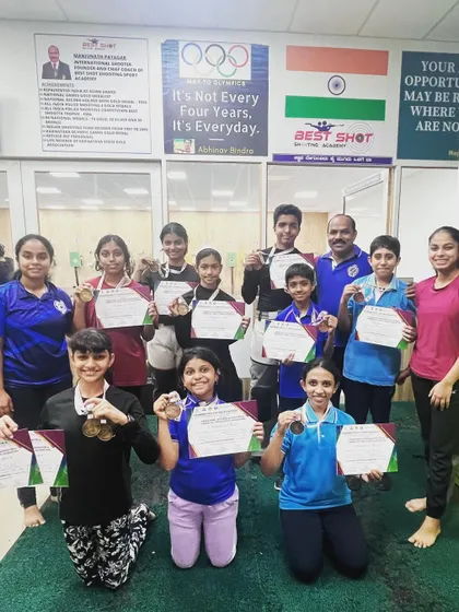 Our team of medal winners from the Tumkur competition, proudly displaying their certificates and medals with their coach.