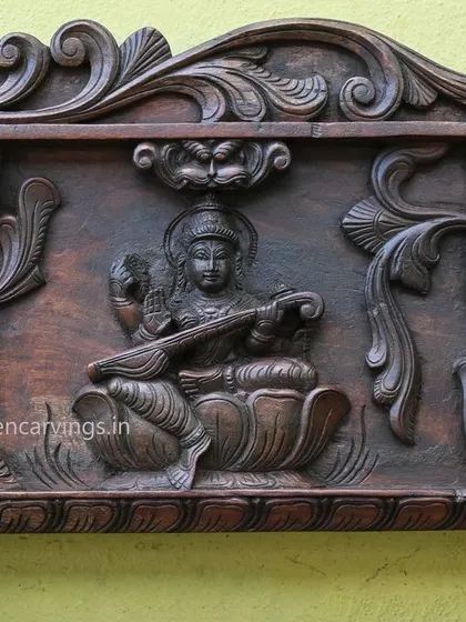 This detail from the large decorative panel shows Goddess Saraswathi with her veena, attended by two peacocks, balancing the composition.
