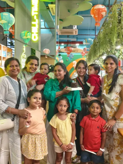 A multi-generational family celebrates a birthday together in our cafe. We provide a comfortable space for everyone to gather, eat, and enjoy the cake-cutting ceremony.