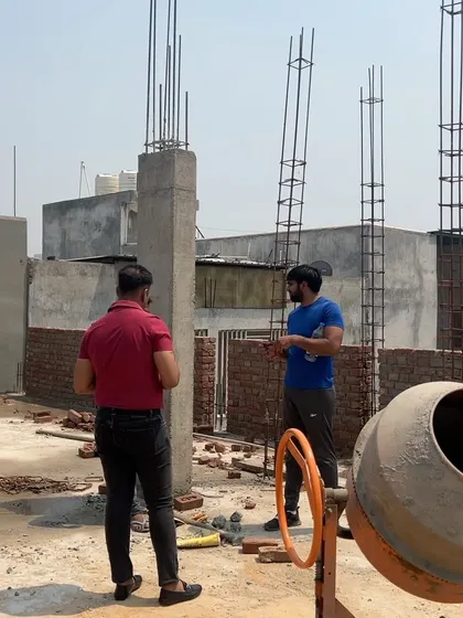 Discussing the next steps for the structural columns on a rooftop. This level of hands-on management is part of my turnkey promise.