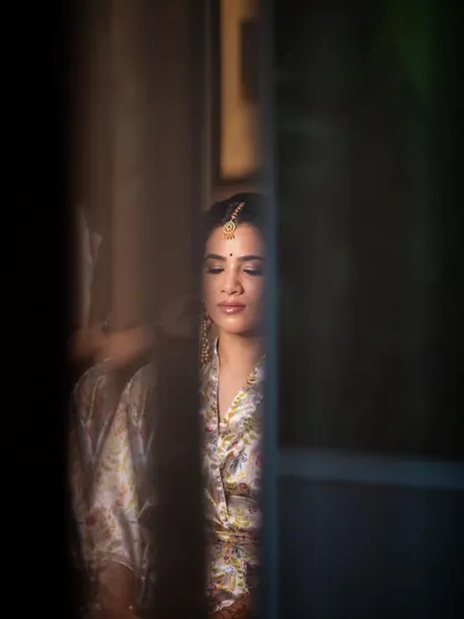 An artistic, candid shot capturing a moment of quiet reflection before the ceremony.