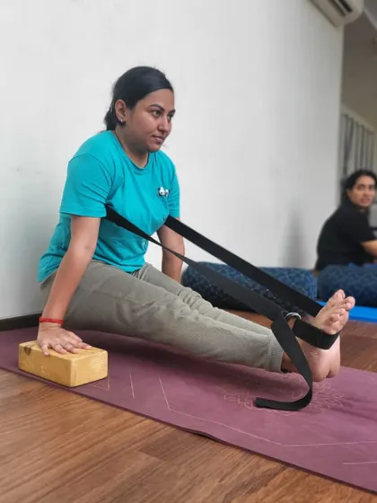 Here, a student uses both blocks and a strap to practice Brahmacharyasana. The blocks provide elevation to make the lift more accessible, demonstrating how we intelligently modify poses to suit each individual's body.
