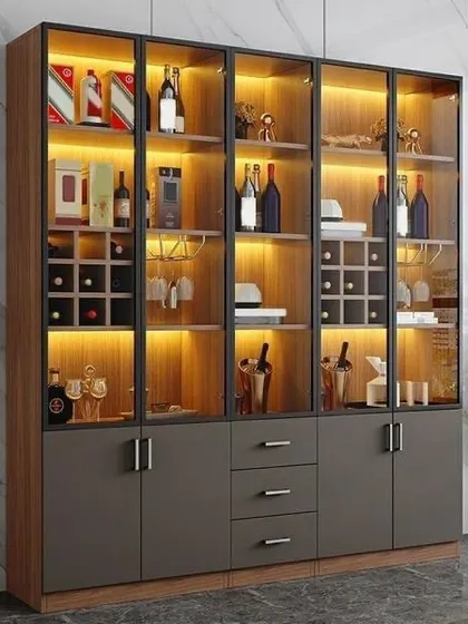 This bar and crockery cabinet is perfect for entertainers. It features dedicated wine racks, glass holders, and ample storage for bottles and glassware, all beautifully lit.