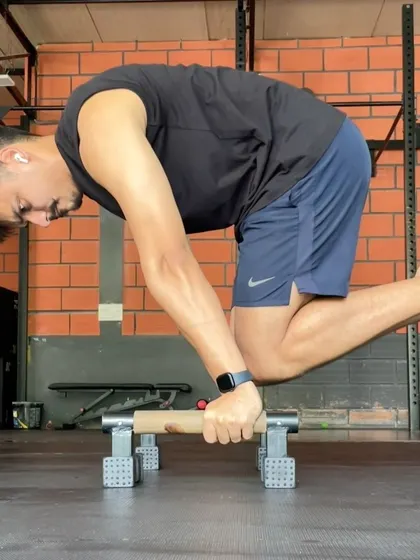 Back to work after a short break. The grind for advanced calisthenics skills like the planche and front lever never stops. Here I am working on a tuck planche on the parallettes.