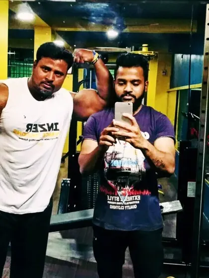 A quick selfie with a student. The gym is where we build not just muscle, but also lasting friendships.