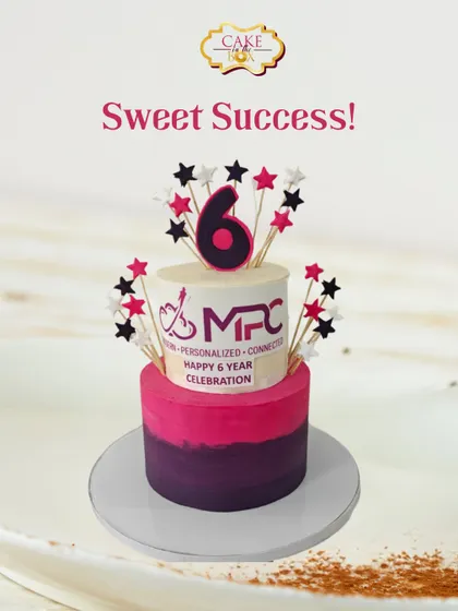 Celebrating six sweet years of success for MPC. This two-tiered cake features a pink and purple ombre design, the company logo, and star toppers to mark the special occasion.