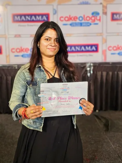 Holding my 2nd place winner certificate at the Cakeology 2024 event. I am so honored and humbled to be recognized for my work.
