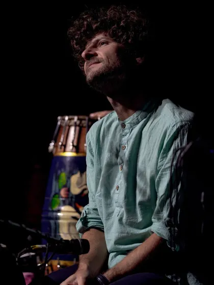 A dramatic shot of Michael League, bathed in light, during our concert in Delhi. His focus and passion are palpable in this image.