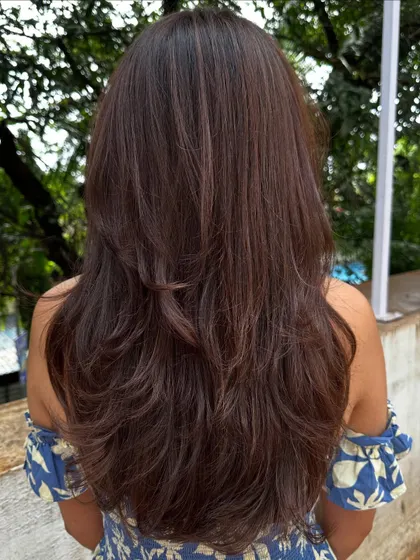 A simple color refresh and a trim can do wonders. Here, I reshaped her layers to bring back volume and movement.
