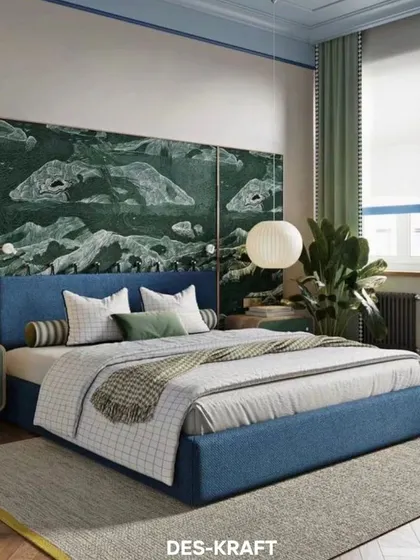 A nature-inspired bedroom featuring a stunning green landscape mural as a headboard, complemented by a blue upholstered bed and natural textures.