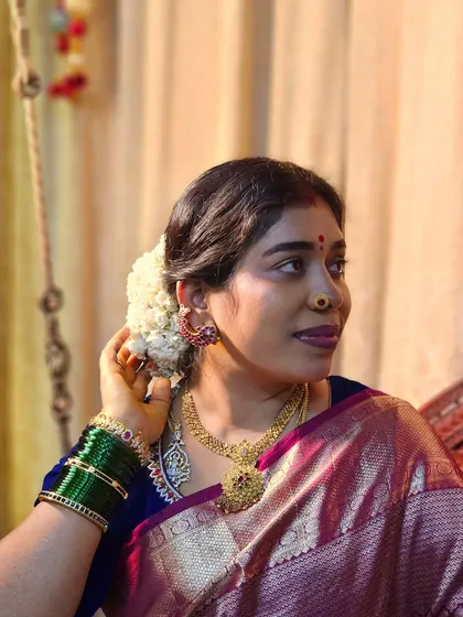 A moment of quiet reflection before a pooja. Adorning my hair with fresh jasmine flowers is a simple act that makes me feel connected to our culture.