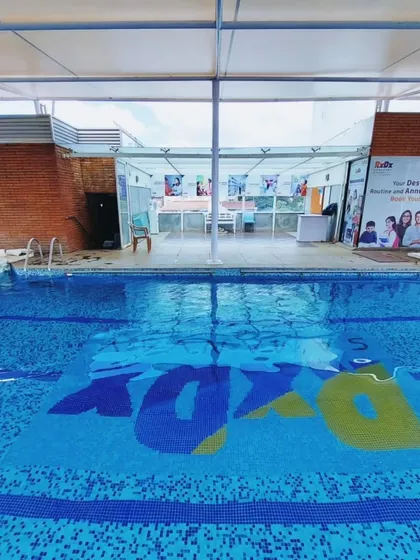 The view from the shallow end of our RxDx pool in Malleshwaram. Being covered and heated means you can focus on your lesson, whatever the weather is doing outside.