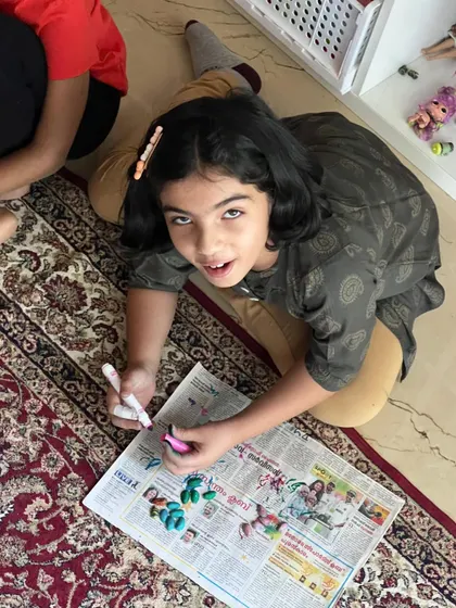 These images showcase the variety and fun of our hands-on crafting sessions, from making jewelry to creating art from recycled materials.
