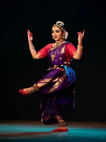 Meera Krishna in a dynamic pose, showcasing the energy and fluid motion that characterize her dance style.