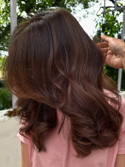 A side view showing the soft, face-framing layers and the seamless blend of colors.