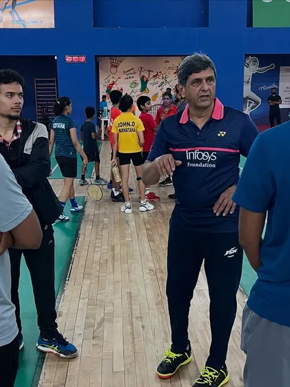 The mentorship continues off the court. Prakash sir discusses strategy and technique with our coaching staff, ensuring our curriculum remains world-class.