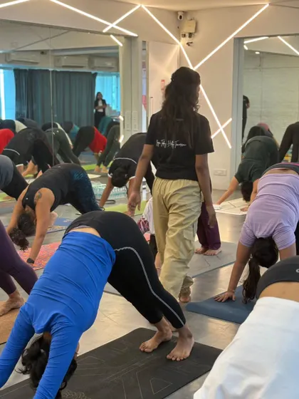 Students move together in a synchronized flow during our Yoga Day event. Practicing as a group amplifies the energy and creates a strong sense of connection and community.