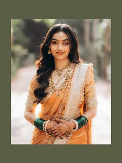 A beautiful, serene portrait of the bride. The soft focus and natural background create a gentle, timeless look that lets her natural beauty shine.