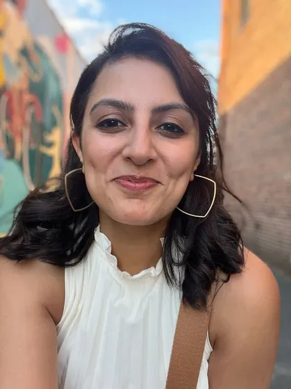 A simple, happy selfie taken in an alley with some cool street art. Just enjoying the day.