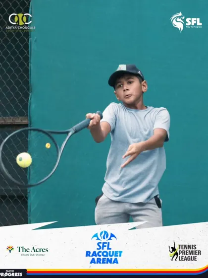 The moment of impact. This action shot captures the focus and technique of one of our students as he executes a forehand during a premier league match.