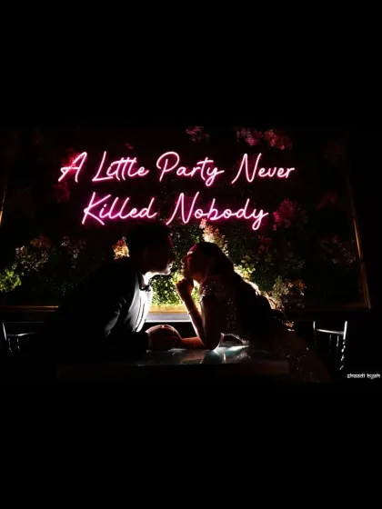 "A Little Party Never Killed Nobody." This silhouette from a cocktail night captures the cool, modern vibe of the celebration. It’s a stylish shot that shows the fun side of the wedding festivities.