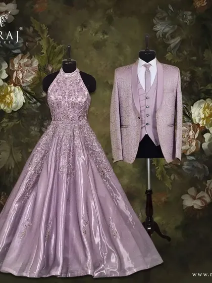 A harmonious blend of grace and sophistication. The groom's lavender Italian suit with self-embossed embroidery is the ideal match for the bride's alter neck voluminous gown.