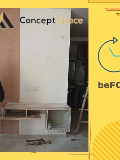 The "Before" shot of the same TV unit project. This shows the raw construction phase, with the basic plywood structure being installed before the final finishing touches are applied.