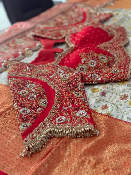 The full layout of the red bridal blouse.
